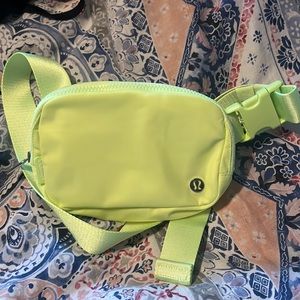 Lululemon neon yellow belt bag. Perfect condition never worn without tags.